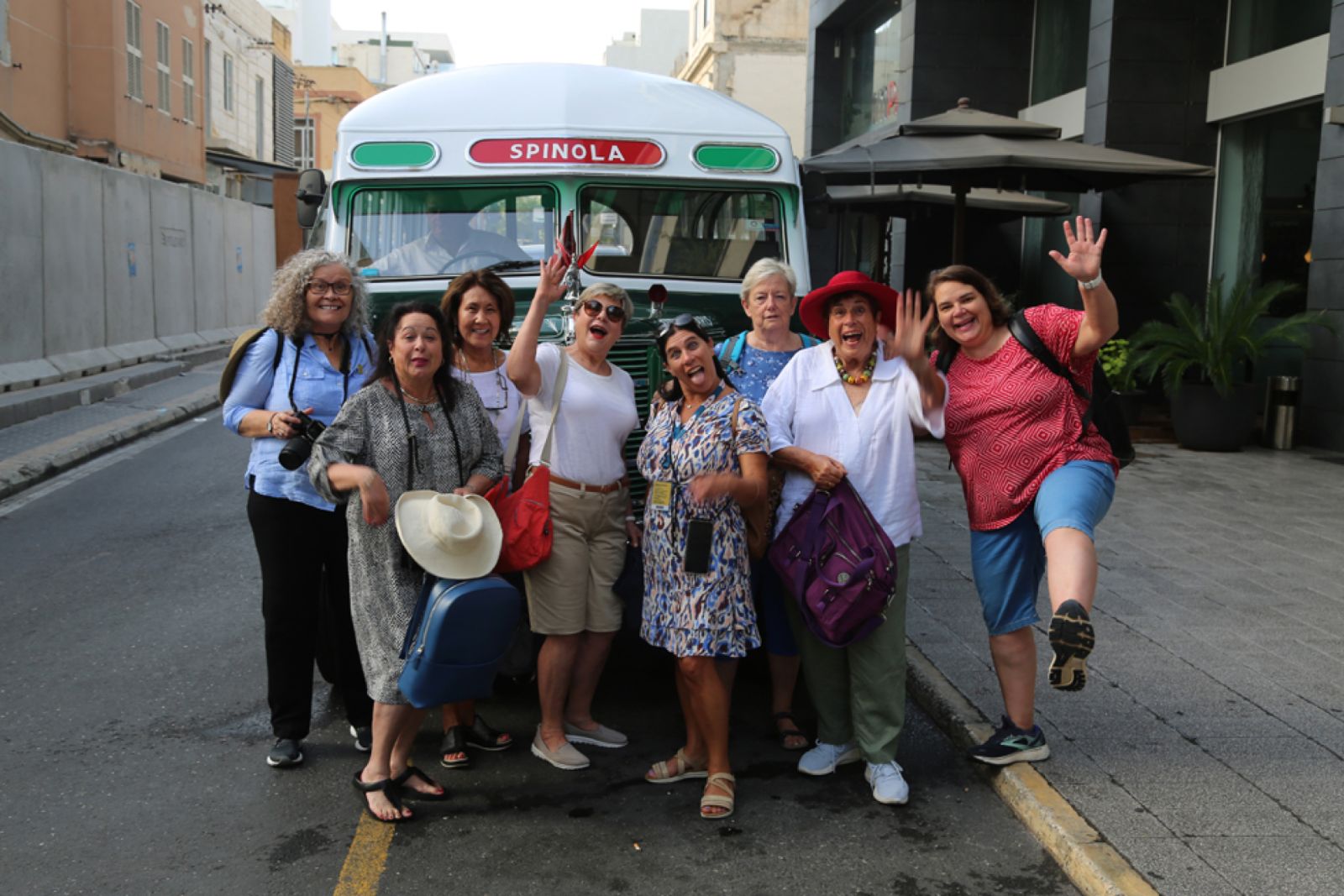 Travellers and a vintage Maltese bus